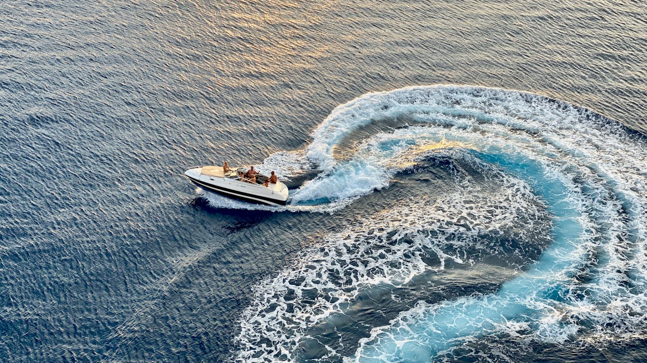 Services Experience the thrill of a speedboat creating dynamic waves in the Caribbean Sea off Arubas coast.